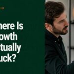 Business owner reviewing growth data to find the bottleneck limiting growth